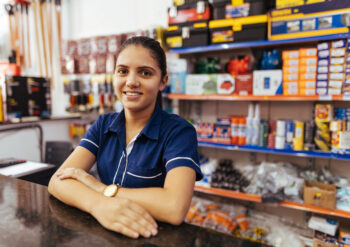 Young latin woman working in hardware store